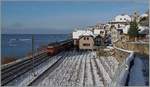 Schnee und Sonne im Lavaux sind recht selten, doch Ende Dezember 2014 war es wieder einmal so weit, als eine Re 460 mit ihrem IR Richtung Brig bei St-Saphorin vorbei fuhr.