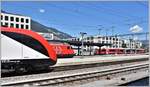 RE5072 mit Twindexx 9485 0502 009-9, IC572 mit 460 110-0  Mariaberg  und S1 1519 mit ABe 4/16 3105 in Chur. (13.07.2018)