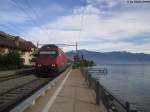 Re 460 069-8 ''Verkehrshaus'' am 17.10.2012 in St.Saphorin als IR nach Genf-Flughafen.