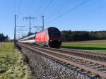 SBB - Gegenlichtaufnahme der 460 058-1 mit RE unterwegs bei Lyssach am 10.01.2015