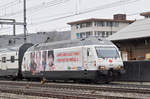 Re 460 041-7, mit der Rotkreuz Werbung, verlässt den Bahnhof Sissach. Die Aufnahme stammt vom 06.03.2017.