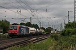 Re 482 007-2 mit einem Containerzug am 09.06.2015 bei der Durhcfahrt in Müllheim (Baden) in Richtung Norden.