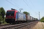 Nachdem Re 482 035-3 wegen Fristarbeiten in der Werkstatt in Bellinzona weilte, bespannte sie am 10.07.2015 einen Containerzug von SBB Cargo International, um wieder zu ihrem Mieter Raildox überführt zu werden. Hier ist Re 482 035-3 bei Hügelheim in Richtung Freiburg unterwegs.