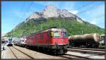 Re 6/6 11648  Aigle  steht abgestellt in Sargans. Im Hintergrund der Gonzen. (05.05.2013)