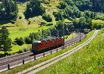 Re 6/6 11613  Rapperswil  kehrt von einer Schubleistung nach Erstfeld zurück.
Aufgenommen am 19.7.2016 in der Wattinger Kurve bei Wassen.