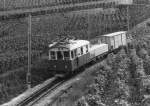 TPC: AL Güterzug nach Leysin mit der He 2/2 12 (1915) oberhalb dem Depot AL unterwegs im Jahre 1999. Die Heizöltransporte fanden viele Jahre per Bahn statt.
Foto: Walter Ruetsch 