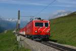 HGe 4/4 II 104 mit Jubiläumsschriftzug  100 Jahre Brig-Gletsch  zieht am 19.07.2014 den R 824 von Nätschen Richtung Oberalppass.