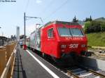 Re 456 095-9 ''100 Jahre Romanshorn - Uznach'' am 5.7.2011 am Shcluss eines Voralpen-Express nach Luzern in Kssnacht am Rigi.
