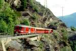 MGB BVZ REGIONALZUG 135 von Brig nach Zermatt am 10.06.1995 auf Faulkinn-Brcke I mit Zahnrad-GepcktriebwagenDeh 4/4 24 - A 2072 - B 2268 - B 2289 - Bt 2253. Hinweis: BVZ-Fahrzeuge noch in alter Lackierung, Blick auf Faulkinn-Tunnel.
