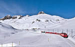 HGe  4/4 II 105 hat soeben die Station Oberalppass verlassen und strebt Disentis zu.Bild 13.1.2.2017