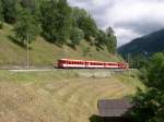 Auf kurvenreicher Fahrt durch das Goms befindet sich dieser Regionalzug der Matterhorn-Gotthard-Bahn bei Lax am 05.07.2005.
