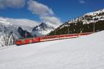 Deh 4/4 I 21 fährt am 21.02.2016 mit einem Sportzug vom Nätschen talwärts Richtung Andermatt.