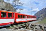 Abschiedsfahrt des letzten MGB ABDeh 8/8; als Anhängelast für den ABDeh dienten die beiden B Mitteleinstieg B 2273 und B 2269, kurz vor Randa, 12.04.2014.