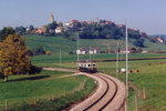 TPF/GFM: Ein Regionalzug nach Bulle mit einem ABe 4/4 bei Romont im Jahre 2005.