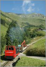 Bei der BRB rauchen nicht nur Dampfloks; Hm N° 10  mit einem Bauzug bei der Planalp.
30. August 2013