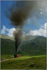 Die klein Bahn macht gross auf sich aufmerksam...
BRB Dampfzug auf dem Weg auf das Brienzer Rothorn bei  Chuamad .
30. August 2013