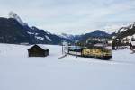 Am Morgen des 06.02.2016 zieht die GDe 4/4 6003 den D 2112 von Montreux Richtung Zweisimmen, aufgenommen oberhalb von Gruben.