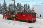 JAHRESRUECKBLICK 2014
von Walter Ruetsch
FEBRUAR
MVR/CEV: Kampf gegen den Schnee in Les Pléiades am 11. Februar 2014 mit der HGe 2/2 1 (1911) und dem X rot e 91. 