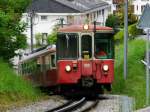 Goldenpass CEV - Steuerwagen Bt 222 mit Zahnradtriebwagen BDeh 2/4 74 unterwegs bei Chevalleyres am 16.05.2015