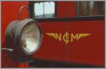 Logo und Stirnbeleuchtung an den alten Triebwagen der Nyon - St-Cergue - Morez (NStCM) Bahn. (Archiv 06/77)