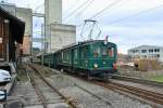 RBS CFe 4/4 Nr. 11, C4 Nr. 61 und Bre 4/4 Nr. 1  Pendler-Pintli  bei Ausfahrt in Lohn-Lterkofen. Beachtung verdient auch das Zugschlusssignal, 12.01.2015.