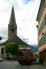 Der Beh 4/8 91 bei der Fahrt vorbei an der Kirche Saint-Clment von Bex in Richtung Bahnhof Bex; 06.10.2013