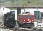 Whrend G 4/5 107 ihren Zug umfhrt, steht Ge 4/4 I 610  Viamala  mit dem Lschzug auf Abruf in Untervaz-Trimmis bereit.