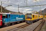 Die drei Dieseloks Gmf 4/4 23404  / 234 02  und die 23403 warten im Bahnhof Ilanz die Weiterfahrt ab.Derweil fährt die Ge 4/4 II 619  Samedan  mit dem Re nach Chur vor.Bild vom 4.11.2015