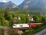 Mit dem Dorf Reichenau im Hintergrund quert der RE 1129 (Chur - St.Moritz) mit der Ge 4/4 III 643  Vals  erst die A13 und dann den Hinterrhein.
Reichenau - Tamins, 08. Mai 2016