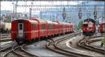 Ein Schnellzug nach St.Moritz verlsst den Bahnhof Chur mit Personenwagen verschiedener Epochen und vor allem einem grosszgigen Angebot an 1.Klasse. Verhltnis 4:4, (04.07.2007)