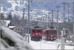 Ge 6/6 II 701  Curia  und Be 4/4 514 Pendel kreuzen sich bei der Ausweichstelle Zizers. (26.03.2008)