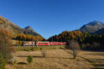 Ge 4/4 II 620 mit einem Regio am 15.10.2017 bei Punt Muragl.