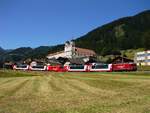 Ein Klassische Motiv der Rhb: Glacier Express mit dem Benedikter Kloster im Hintergrund.
Das Bild zeigt der Lok Ge 4/4 II 623 mit passende Werbefolie mit dem Glacier Express in Richtung St. Moritz.
30.06.2019. Disentis/Mustér