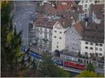 Der Regio 1428 mit Ge 4/4 II 623  Bonaduz  aus Arosa kurvt ums Obertor in der Churer Altstadt.