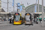 Die beiden Be 6/10 169, auf der Linie 11 und der Tango 158, mit einer Werbung für eine Ausstellung im Schaulager, auf der Linie 10, treffen sich am Bahnhof SBB. Die Aufnahme stammt vom 01.03.2018.