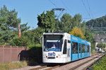 Be 6/8 Combino 307, mit der IWB Werbung, fährt zur Haltestelle der Linie 14 an der Schützenstrasse.