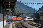 In Faido begegnen sich zwei DB 185 mit einem DB Güterzug und ein SBB ETR 610 auf dem Weg von Milano nach Zürich.
