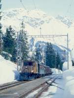 RhB Extra-GmP 3031 fr GRAUBNDENTOURS AG von Landquart nach Davos Platz am 14.03.1999 Einfahrt Davos-Laret mit E-Lok Ge 6/6 I 414 - B 2246 - D 4052II - Gbkv 5568 - Gbkv 5593 - Gb 5082 - E 6610 - Kk 7070.
