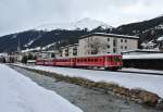 ABt 1716+1713 mit B 2417 und Be 4/4 514 als Skizug R 826 bei Ausfahrt in Davos Platz, 09.03.2013.