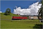 Güterzug nach Landquart mit Ge 6/6 II 701 Raetia  unterhalb von Saas.(06.06.2016)