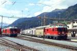 RhB Gterzug 5552 von St.Moritz nach Landquart am 04.09.1996 in Samedan mit E-Lok Ge 4/4 II 619 - Haikqy 5167 - Uce 8083 - Uce 8050 - Uace 7991 - Ucek 8054 - Uce 8037 - Gbkv 5525 - Gbkv 5512 - Gbkv 5518 - Gbkv 5609 - Haikqy 5163. Hinweis: gescanntes Dia
