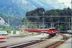 RhB Glacier-Express 555 von (Zermatt)- Chur nach St.Moritz am 25.05.1991 Einfahrt Reichenau mit E-Lok Ge 6/6 II 706 - 2x B - 2x FO B - A - D - 3xB - 2x A.
