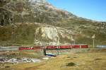 RhB Schnellzug 417 von St.Moritz nach Tirano am 11.10.1999 auf oberer Berninabachbrcke mit Triebwagen ABe 4/4 III 53 - AB 1543 - B 2462 - B 2461 - B 2464. 
