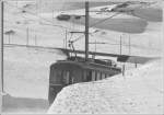Vor bald 100 Jahren, nmlich 1910, wurde die Berninabahn erffnet und das von Anfang an elektrisch. Wenn auch die Fahrleitungen und Stromabnehmer noch etwas anders aussahen, muss es doch damals schon so hnlich ausgesehen haben. ABe 4/4 I 35 auf der Alp Bondo oberhalb Bernina Lagalb. (10.03.2009)