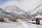 Die ABe 4/4 III 51  Poschiavo  und 55  Diavolezza  verlassen die Alp Grm am 12.10.09 mit dem D 970 BERNINA EXPRESS Tirano - St.