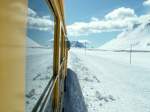 100 Jahre Berninabahn,Der Bernina Nostalgiezug mit ABe 4/4 Nr.34 und 30,in der noch tief verschneiten Bergwelt der Berninagruppe auf der Extrafahrt nach Tirano.28.03.10