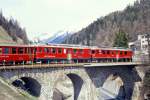 RhB Regionalzug 451 von St.Moritz nach Tirano am 18.12.1991 auf Inn-Viadukt in St.Moritz mit Triebwagen ABe 4/4 II 41 - ABe 4/4 III 51 - AB 1541 - ....
