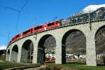 Der RE 1652 auf dem Weg von Tirano nach St. Moritz auf dem Kreisviadukt von Brusio; 23.02.2014