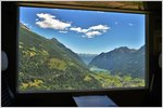 Wie ein Gemälde, so schön präsentiert sich der Lago di Poschiavo aus dem Zugsfenster eines bergwärts fahrenden Allegras bei Cadera.