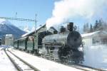 RhB DAMPFZUG fr GRAUBNDEN TOURS 3723 von St.Moritz nach Scuol am 02.03.1997 in Cinuos-che-Brail mit Dampflok G 4/5 108 - A 1102 - B 2060 - D 4052I - B 2245.
